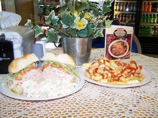 store cooked turkey on hard roll with French fries yum