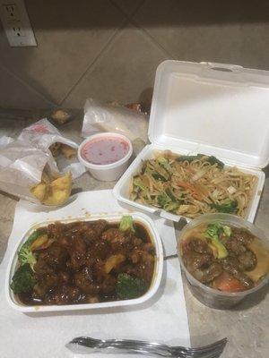 Beef and broccoli, crab rangoon, veggie lo mien and orange chicken. All delicious! Not shown: huge side of steamed rice.