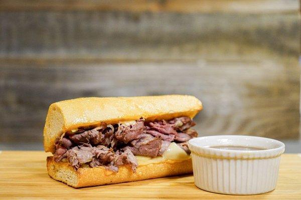 Our French Dip. Roast Beef thinly sliced, Swiss Cheese, Au Jus, Served Hot