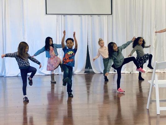 Kids Hip Hop class practicing balance.