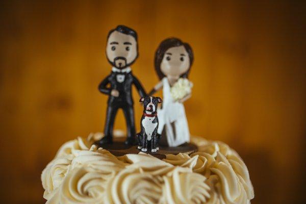 Our adorable cake topper, complete with our pup, Tyson