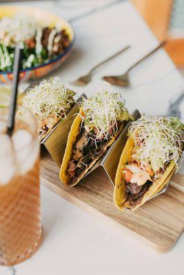 Our Locos Tacos: black bean spread, sauteed mushrooms, pico de gallo, spicy aioli, sprouts.