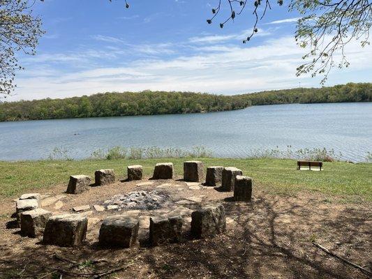 Not a mini Stonehenge.  A lakeside fire pit.