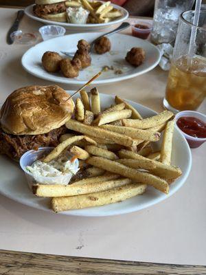 BBQ sandwich with fries and coleslaw.