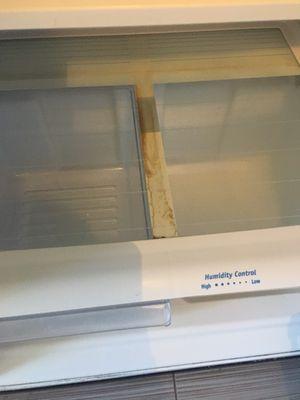 Dirty refrigerator and missing drawer upon move in.