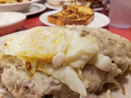 Chickenfried steak with overeasy eggs on top.