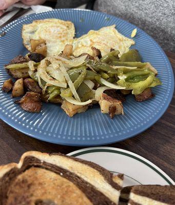 Amazing eggs and home fries.