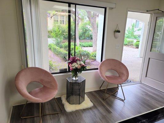 Reception waiting area overlooking lush garden area.