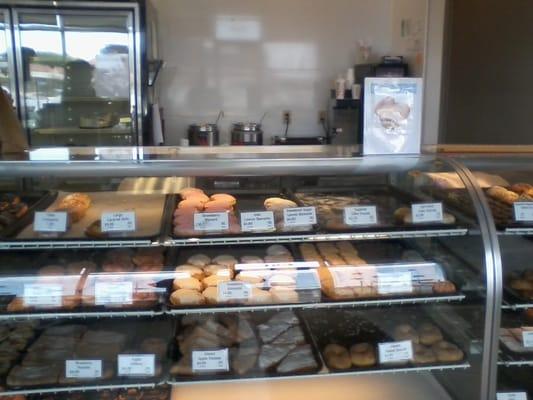 A display case filled with donuts.