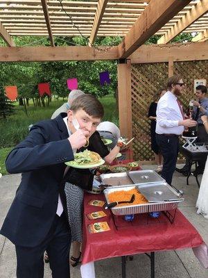 Groom enjoying a taco!