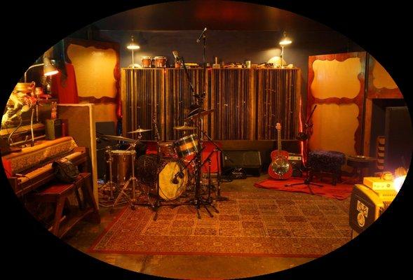 Treated live room with drum set.