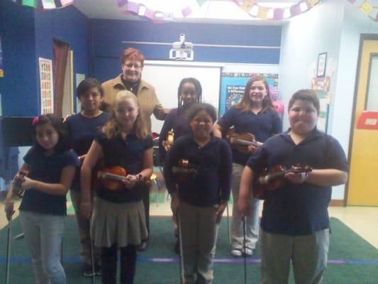 Sue Lewis with some of  her students performing at Shaver Elementary in Portland.