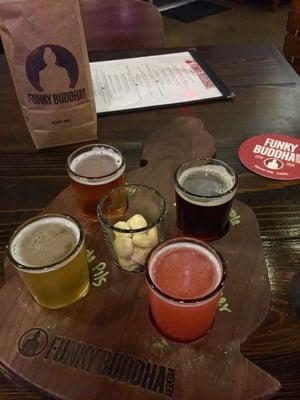 Flight: Pineapple Pilsner, raspberry berliner, Bonita applebum, and blueberry cobbler Gourmet popcorn: Honey BBQ