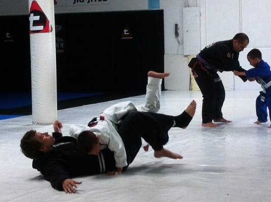 Cristian practicing hi take down in BJJ class.