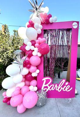 Barbie-themed birthday with Barbie box and balloon garland