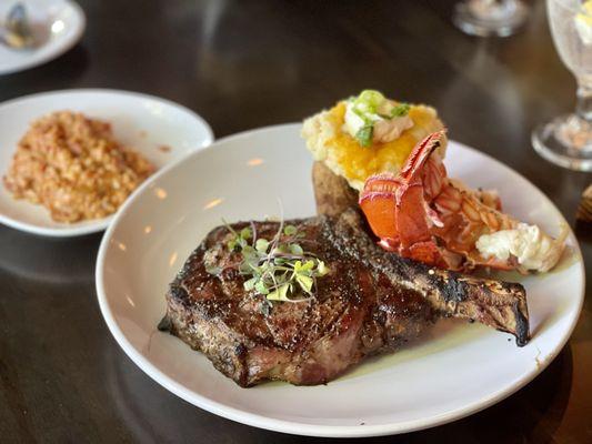 Dry aged Bone-In Ribeye, Lobster tail, Twice Baked Potato Volcano and the tomato risotto. Delicious!