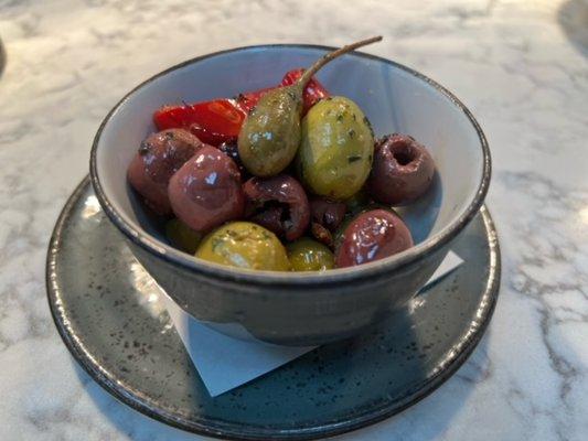 Warm Marinated Olives. Orange zest, fennel seed, herbs