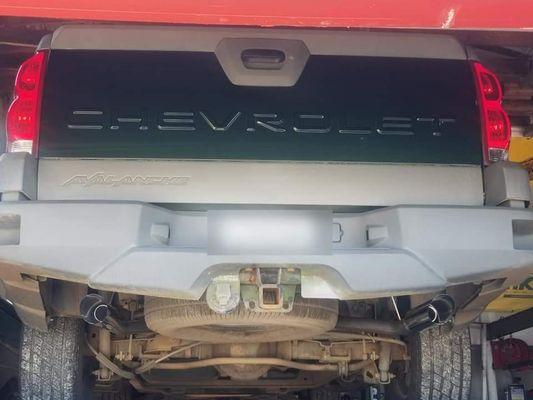 Custom dual out exhaust on a Chevy Avalanche.