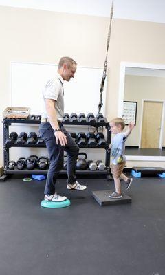 family physical therapist working with child