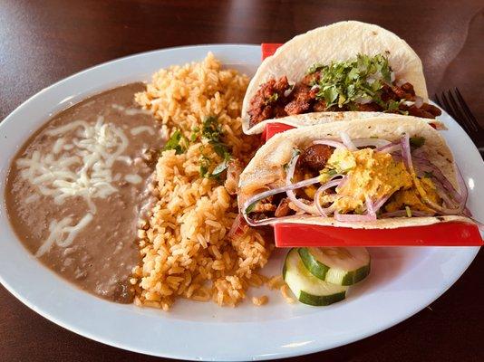 Taco Al Plato with 2 tacos (Chicharron Acevichado & Al Pastor) and rice & beans ($13.99).