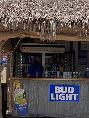 Beer hut- This guy is hot so he's had both doors of the fridge open for over an hour. Wonder how cold that beer is gonna be?