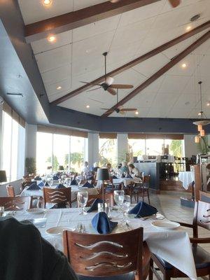 Inside dining w/ most tables looking out over Estero Bay