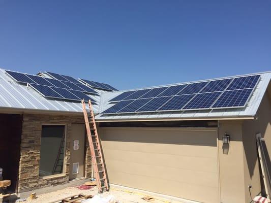 Galvalume metal roofs and silver framed solar panels go great together.