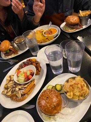 Impossible Burger with side of Macaroni & Cheese, buffalo chicken dip, banana and nutella french toast with fruit and home fries