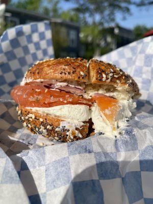 Everything bagel with cream cheese, lox, onion, and capers.