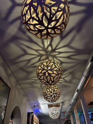 The amazing ceiling fixtures that cast light so beautifully.