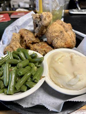 Half fried chicken dinner with green beans, mashed potatoes and gravy and slaw (mia). I'm am told all of the locals dine here also.