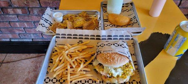 The hawaiian, fries, tostones, and a colombian empanada