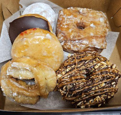 Cronut, Samoa, sour cream, guava filled, jelly filled and Bavarian filled