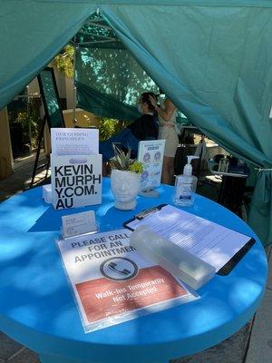 View into Recharge Salon cozy outdoor awning