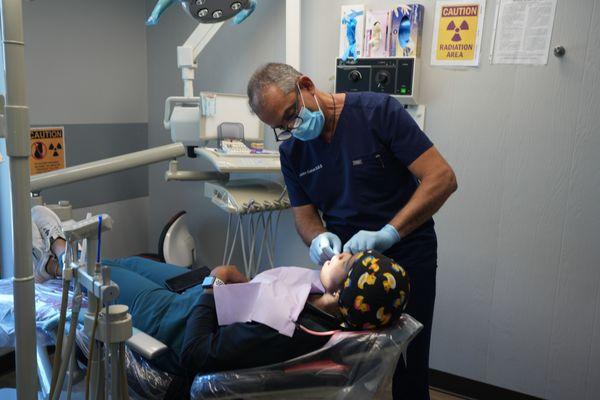 Dr. Cohen working on a dental implant patient.