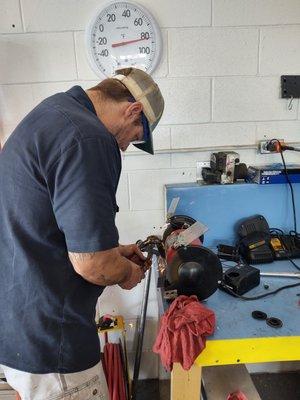 Our ASE Certified Mechanic, James, using the grinder