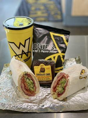 Grinder, chips, brownie and a drink