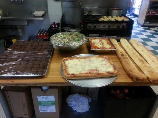 The owner let me take sneak peak in the back! Stromboli and Sicilian pizza, so clean in the kitchen!