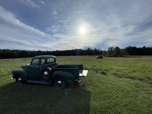 Beautiful Valley View Farm with an old Chevy in the foreground