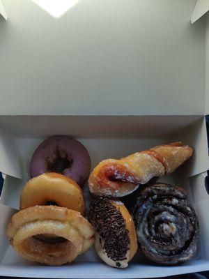 Donuts we got including the strawberry bowtie, an old-fashioned, and orange.