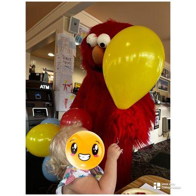 Elmo stopped by, gave my daughter a ballon and made her day.