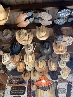 This was in the saloon!! Hats and boots hanging from the ceiling.