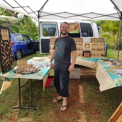 Tim with Kauai made coasters, key chains, and ornaments.