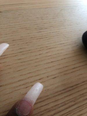 Nail is snapped in half and bleeding