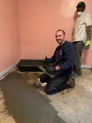 Concrete patching after installing new sewer pipe under home.