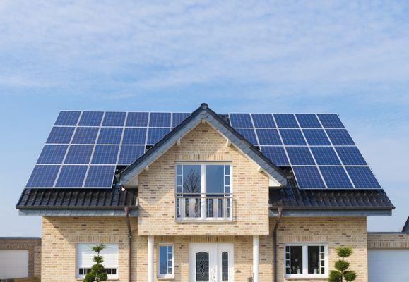 Solar equipment installed on a pitched Spanish tiles roof.