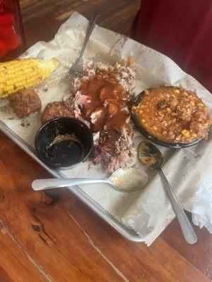 Bbq plate with Brunswick stew, fried corn and hush puppies