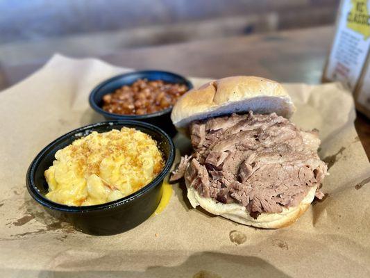 Moist brisket sandwich with beans and mac and cheese