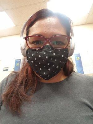 Me in the waiting room with my mouth mask and headphones to help keep me entertained  for the estimated 2+ hours wait time to see Dr Dang.