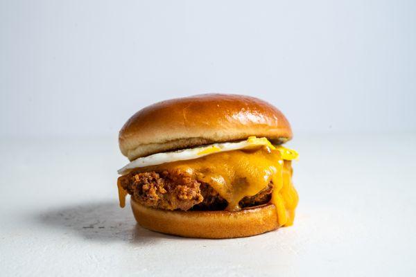 Breakfast Egg, Cheddar and Chicken Sandwich served on a Brioche Bun